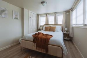 a bedroom with a large bed with a blanket on it at Sage Haven #6 in Johnson City