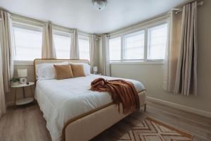 a bedroom with a bed with a blanket on it at Sage Haven #6 in Johnson City