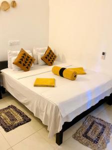 Postel nebo postele na pokoji v ubytování Sigiri Rock Side Home Stay + 37 fotografií