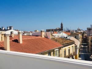 a view of roofs of buildings in a city at Charming home with private terrace,heart of Málaga in Málaga