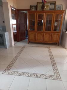 a living room with a rug on the floor at Apartment El Jadida in El Jadida