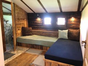 a small room with a bed and a couch at Anna Porta in Kan