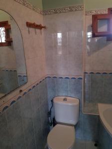 a bathroom with a white toilet and a sink at Apartment El Jadida in El Jadida