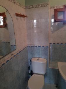 a bathroom with a white toilet and a sink at Apartment El Jadida in El Jadida +4 photos