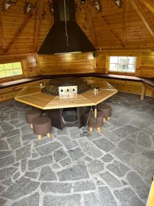 a large room with a wooden table and chairs at Haus Monica in Bodenmais