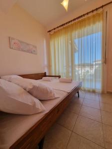 Postel nebo postele na pokoji v ubytování Lux Siviris apartments