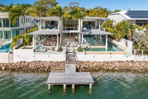 an aerial view of a house in the water at 12 Noosa Parade, Noosa Heads in Noosa Heads