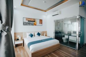 מיטה או מיטות בחדר ב-Dong Hai Hotel _ Rach Gia