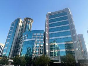 a group of tall glass buildings in a city at ROYAL CONCORDE HOTEL&SUITE in Dubai