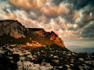 a view of a city with a mountain in the background at La Terrazza sul blu di Capri in Capri