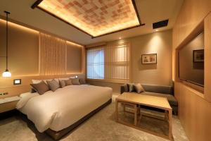 Postel nebo postele na pokoji v ubytování Hotel Gion Ichirin