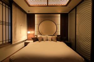 Postel nebo postele na pokoji v ubytování Hotel Gion Ichirin