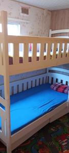 a wooden bunk bed in a room at Domek nad Stawami - Warmia in Jonkowo