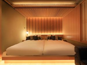 Postel nebo postele na pokoji v ubytování Hotel Gion Ichirin
