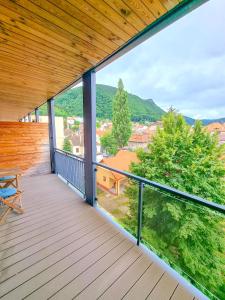 a balcony with a view of a town at HVA Premium Apartments in Braşov