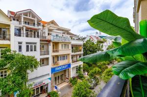 a view of an apartment building with a palm leaf at Spring Hill Apartment -The High Class in Ho Chi Minh City