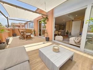 a living room with a couch and a table at La Sardina de Denia in Denia
