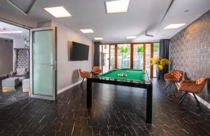 a billiard room with a pool table at Leonardo Boutique Hotel Krakow City Center in Kraków