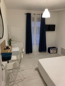 Ένα ή περισσότερα κρεβάτια σε δωμάτιο στο Hotel La Défense