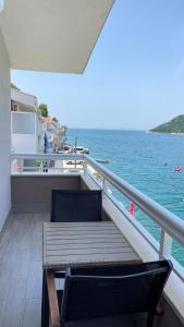 a bench sitting on the deck of a boat at Apartments Tiho & Jelena in Blace