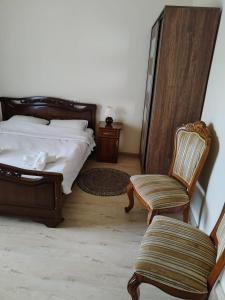 Giường trong phòng chung tại Garni Guesthouse