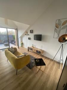 Telewizja i/lub zestaw kina domowego w obiekcie Gîte La Terrasse du 37