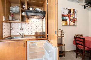Η κουζίνα ή μικρή κουζίνα στο Residence Paradiso Bilocale 101