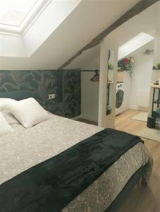 Łóżko lub łóżka w pokoju w obiekcie Gîte La Terrasse du 37