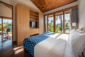 Postel nebo postele na pokoji v ubytování MASMARA Resort Canggu