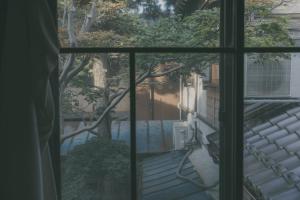 a view from a window of a yard at Nari Nuttari Nari in Niigata