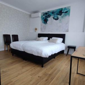 Postel nebo postele na pokoji v ubytování B&B L’Orangerie