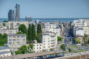 a view of a city with a train at Apartament Panorama in Gdynia