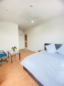 Katil atau katil-katil dalam bilik di Pall Residency