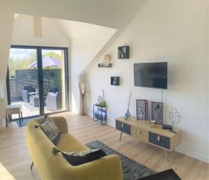 Telewizja i/lub zestaw kina domowego w obiekcie Gîte La Terrasse du 37