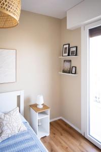 Uma cama ou camas num quarto em Appartamento Nautilus