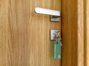 a tag on a door with a key at Papadatos Studios in Argostoli