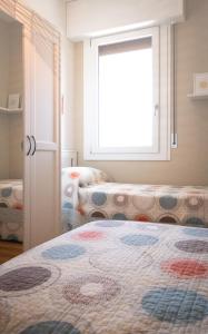 Uma cama ou camas num quarto em Appartamento Nautilus