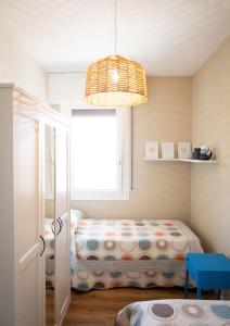 Uma cama ou camas num quarto em Appartamento Nautilus
