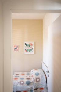 Uma cama ou camas num quarto em Appartamento Nautilus