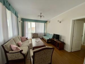 a living room with a couch and a table at Wild Cherry Apartments in St. St. Constantine and Helena