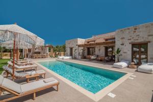an image of a villa with a swimming pool at White Stone Villa Hesperia - Poolside Escape Close to Laganas Beach in Lithakia +58 photos