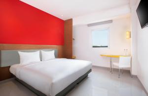 Postel nebo postele na pokoji v ubytování Amaris Hotel Samarinda