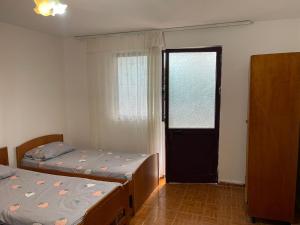 Postel nebo postele na pokoji v ubytování Nana's Rooms