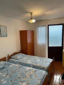 Postel nebo postele na pokoji v ubytování Nana's Rooms