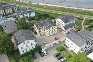 an aerial view of a city with houses and cars at Strandtraum in Glowe