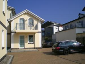 a black car parked in front of a building at Strandtraum in Glowe