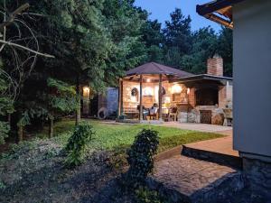 a backyard with a gazebo and a patio at Holiday house Ilidza Sarajevo in Crkvine