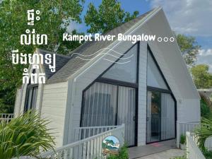a tiny house with a pitched roof at Kampot River Bungalow by MAMA in Kampot