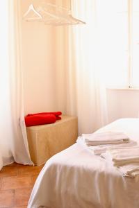 Postel nebo postele na pokoji v ubytování Palazzo Palloni Boutique Apartment