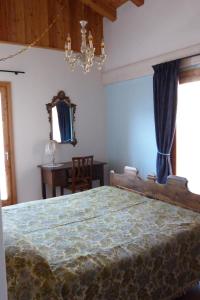 A bed or beds in a room at agriturismo la Meta
